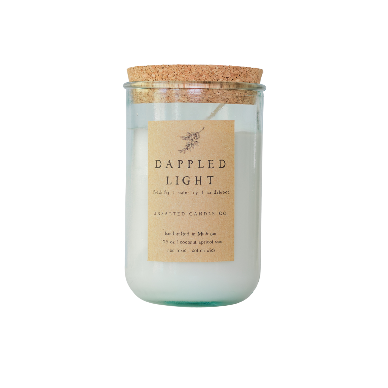 Clear glass jar candle filled with white wax and capped with a natural cork lid. The tan paper label reads 'DAPPLED LIGHT' and 'UNSALTED CANDLE CO.' on a plain white background.