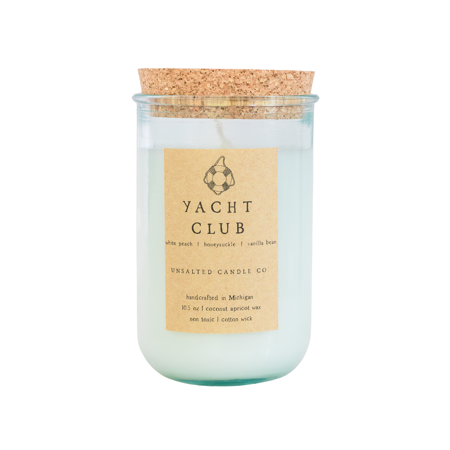 A glass jar candle with a cork stopper and a beige paper label reading 'YACHT CLUB' and 'UNSALTED CANDLE CO', shown on a plain white background.